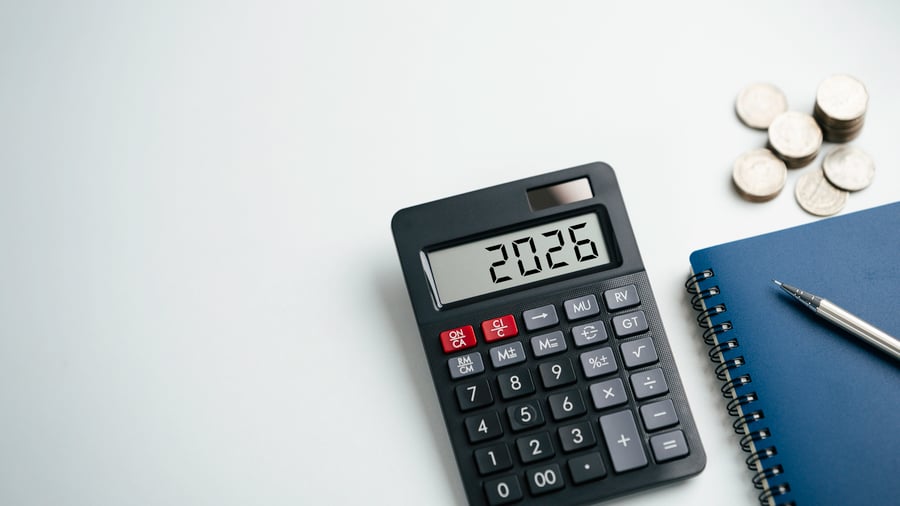 Calculator displaying 2026 year on desk for financial and tax planning