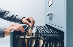 Man searching for files at office