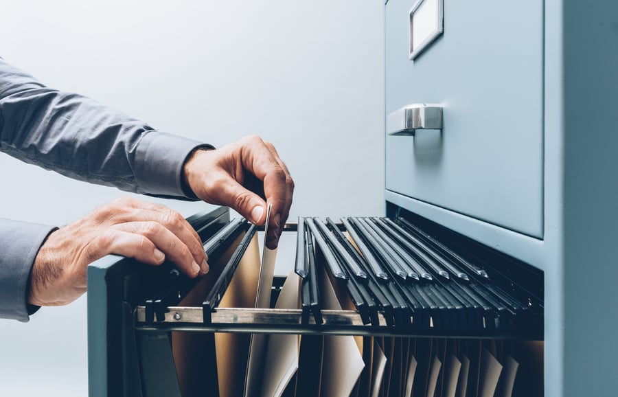 Man searching for files at office