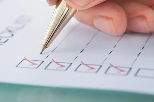 businessman preparing a checklist
